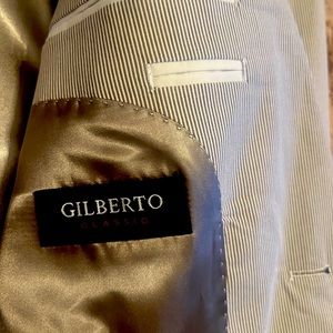men’s jacket- new without tag- never been used- strips- Gilberto